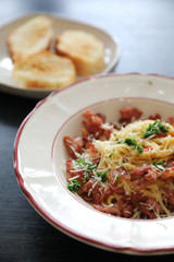Spaghetti white sauce (Spaghetti Carbonara) with bacon and garlic , on wood table background