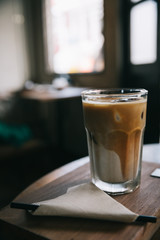 cappuccino or Latte ice coffee made from milk on the wood table in coffee shop