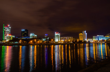 Reflection of the city night illumination of Minsk in the river Svisloch