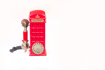 Retro old red telephone on white background.