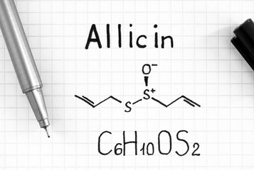 Chemical formula of Allicin with black pen.