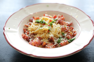 Spaghetti white sauce (Spaghetti Carbonara) with bacon and garlic , on wood table background