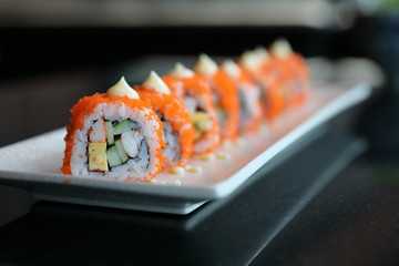 california roll sushi , rice roll with egg avocado egg and fish japanese food