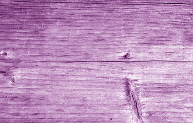 Wooden board texture in purple color.