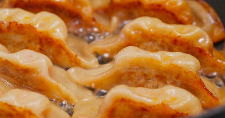 Fry meat dumpling on pan in kitchen
