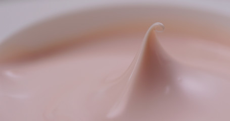 Pink cosmetics lotion close up