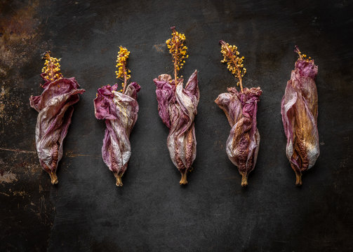 hibiscus blooms on metal tray