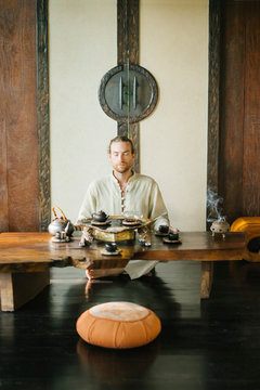 Meditating master conducting tea ceremony