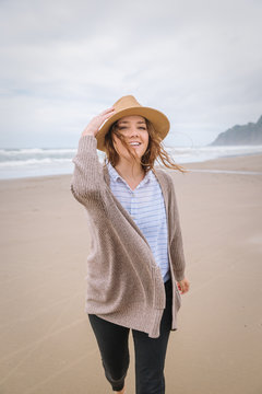 Playful portrait of woman on the beach.