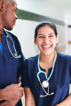 Portrait of two young smiling doctors