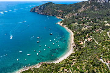 The coastline of Monte Argentario on a summers day. A stunning landscape and blue/turquoise ocean.