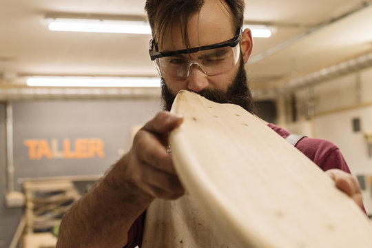 Craftsman checking polished deck