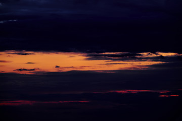 Beautiful sunset - dark sky with clouds and sunlight
