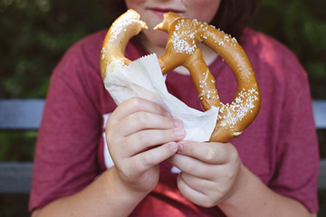 Playing tourist in Central Park NYC eating a pretzel
