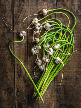 garlic scapes on wood