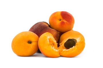 Red peach and apricots on white background