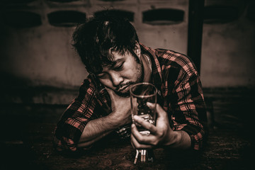 Asian man drink vodka alone at home on night time,Thailand people,Stress man drunk concept