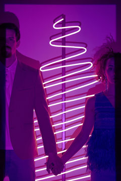 Couple On Ultraviolet New Year Party