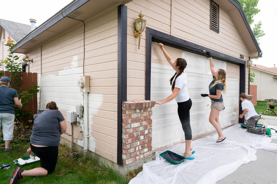 Volunteers Painting a House