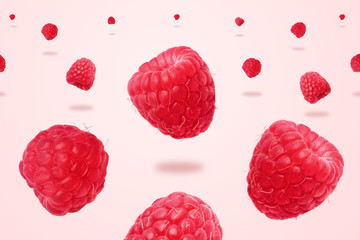 Raspberries levitating over pink background,  food background with summer berries. Creative minimalism