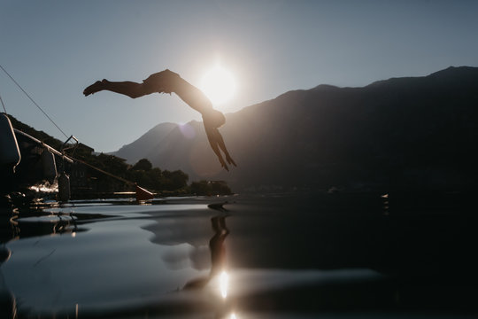 Young Man Jumping In River