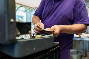 Food Truck: Cook Counts Payment Into Cash Box