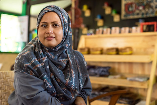 Muslim woman in a cafe