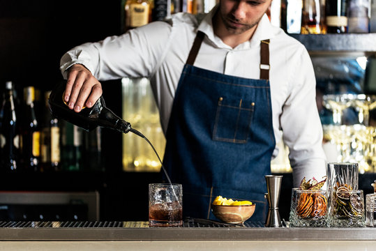 Professional young bartender working
