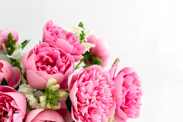 Bouquet of beautiful pink peonies in straw basket - obrazy, fototapety, plakaty