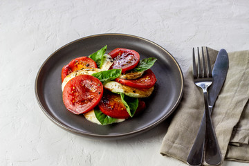 Italian caprese salad with mozzarella and tomatoes. White background. Healthy food.