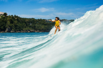 Surfer girl in yellow swimwear