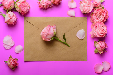 Envelope of craft paper with pink roses. Congratulation with wedding, birthday, valentines day.