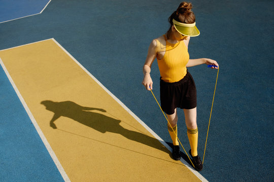 Young woman exercising on playground