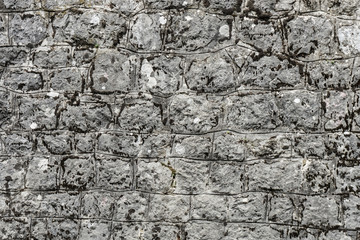 Rough granite Brick wall background. Background texture of stone wall.