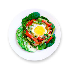 Healthy delicious keto paleo breakfast: egg in a hole with colorful vegetables on white plate. White background. Top view.