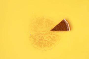 One slice of pie on yellow background