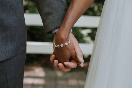 Wedding Bride and Groom Holding Hands