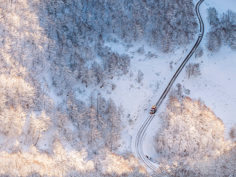 Spain, Asturia, Picos de Europa, Mirador De Piedrashistas, snow plow truck clearing road in winter