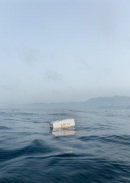 Human waste floating adrift by the ocean