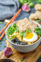 Ramen noodles with pork and pickled egg.