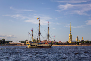 ancient Russian military sailing ship Poltava on the parade in Saint Petersburg in the Neva River against the background of the Peter and Paul