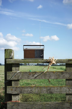 old transistor radio playing on the countryside