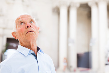 Man observing museum exposition