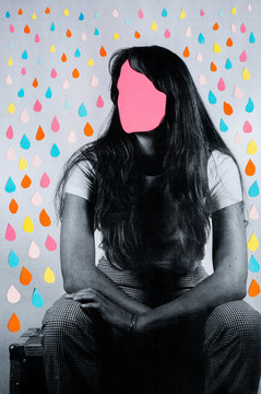 Woman with blank pink shape on face and colorful raindrops