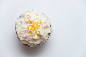 Cake. Cup cake on white table, on white background.