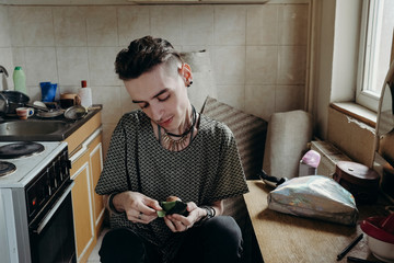 Portrait of a skinny young male model at home