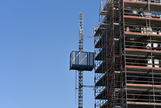 working elevator on a building under construction