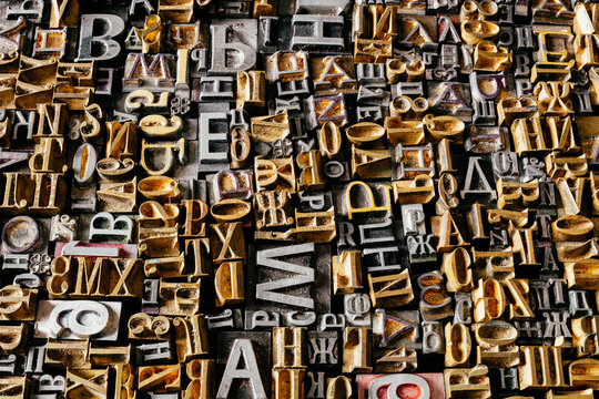 Dusty old metal letterpress type pieces background