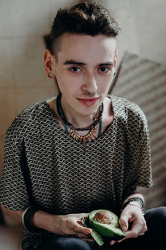 Portrait of a skinny young male model at home