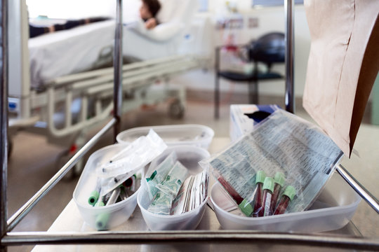 Blood collection tubes on a trolley in a hospital room